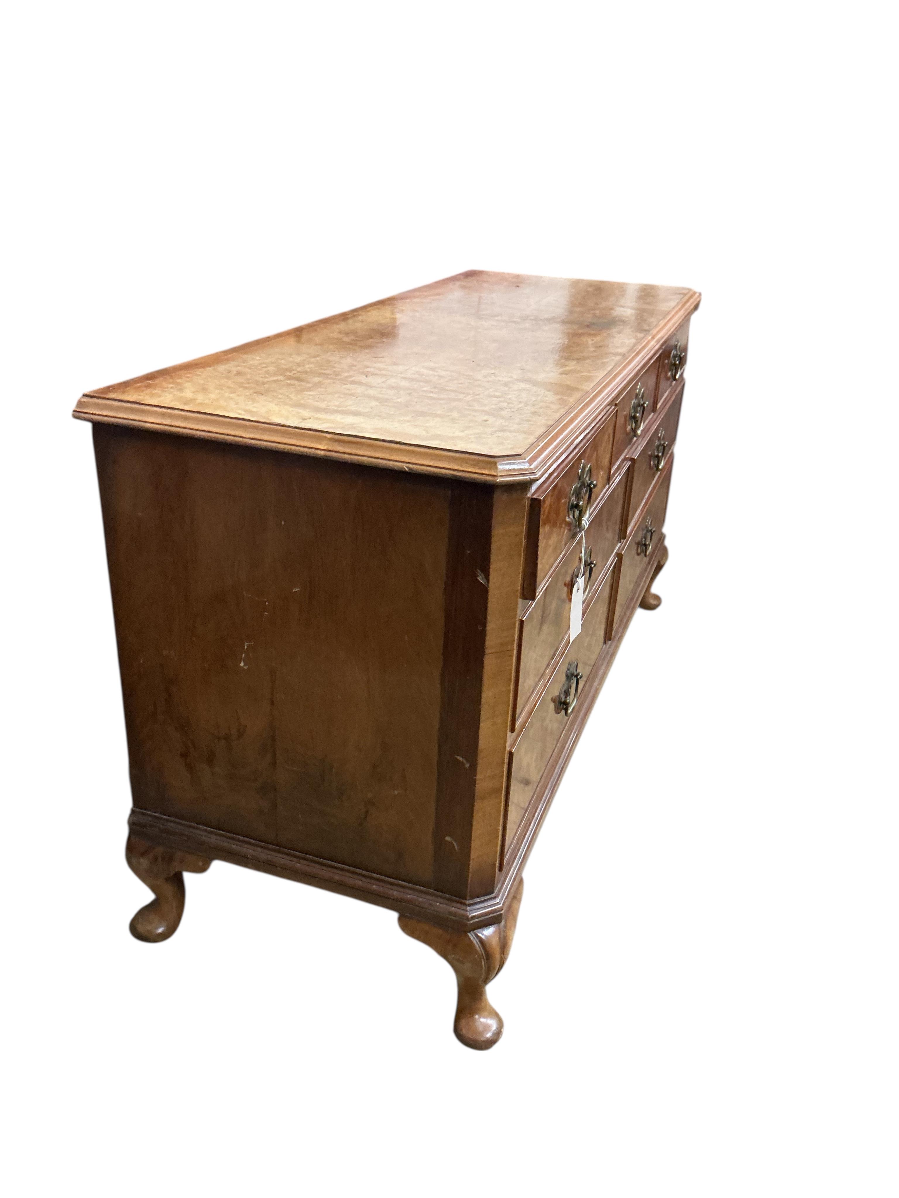 A Queen Anne Revival walnut low chest, width 124cm, depth 46cm, height 66cm